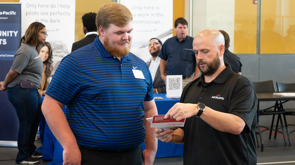 Students and employers at career fair